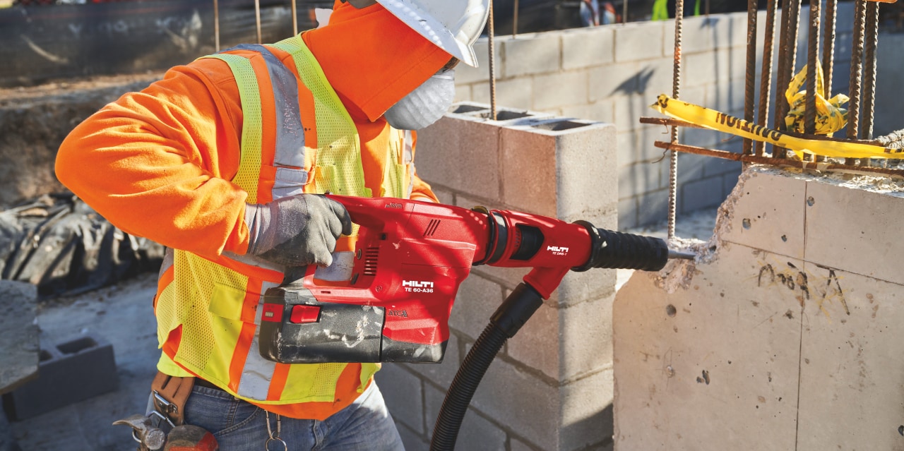 Construction worker using a TE 60-A36 Cordless combihammer with Active Torque Control (ATC) to help prevent kickback