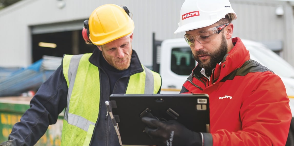 Two construction workers in a site