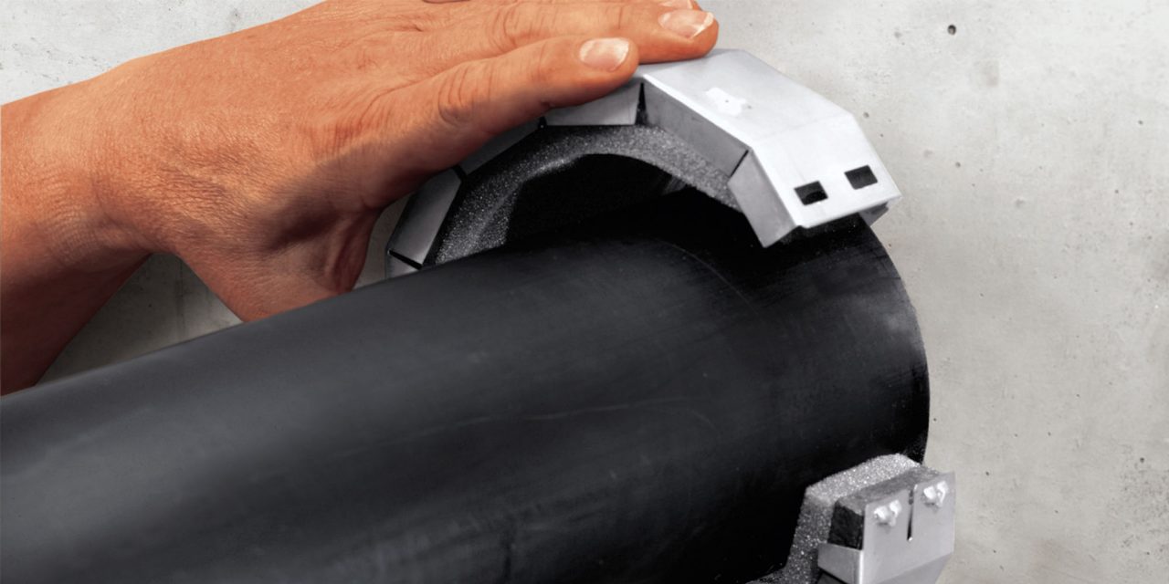 Photo of a CFS-B Firestop bandage and a CFS C-EL Firestop endless collar around mechanical pipes 